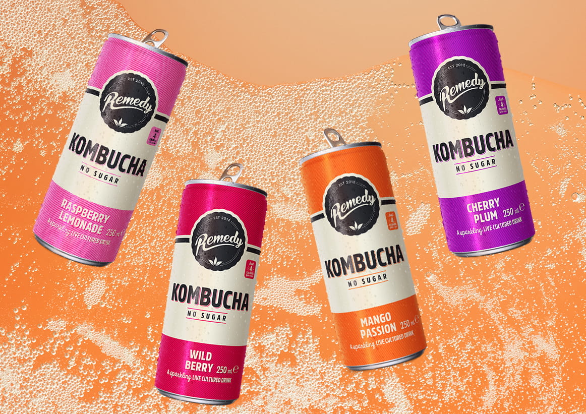 Remedy Kombucha Cans with Fizzy Kombucha Background