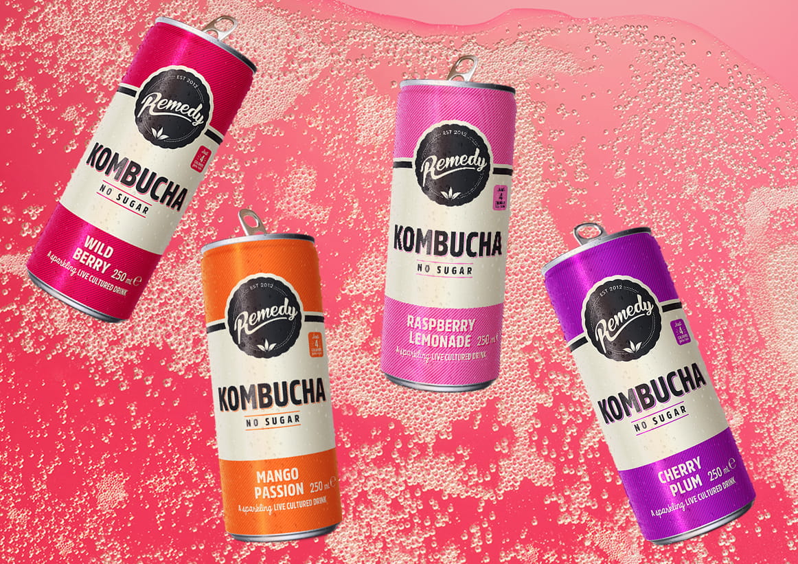 Remedy Kombucha Cans with Fizzy Kombucha Background