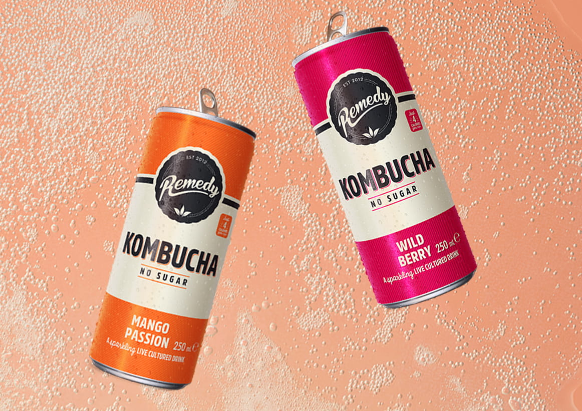 Remedy Kombucha Cans with Fizzy Kombucha Background