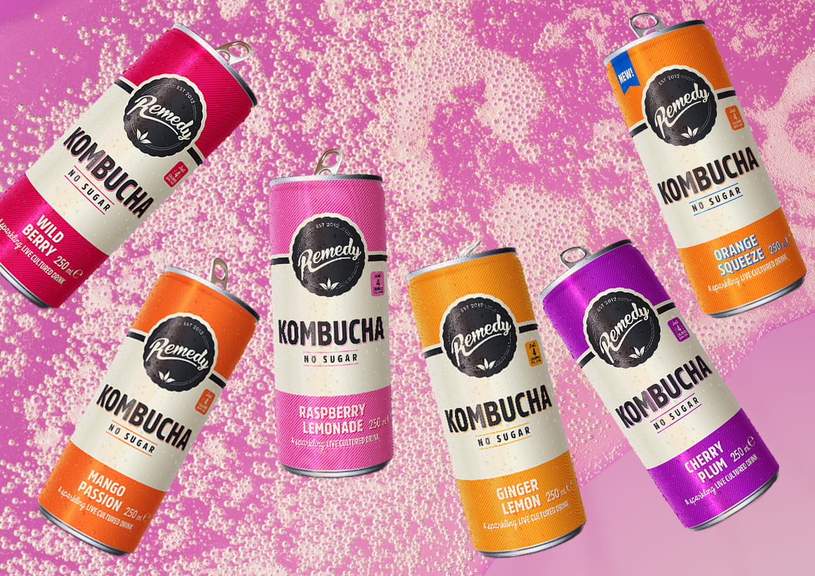 Remedy Kombucha Cans with Fizzy Kombucha Background