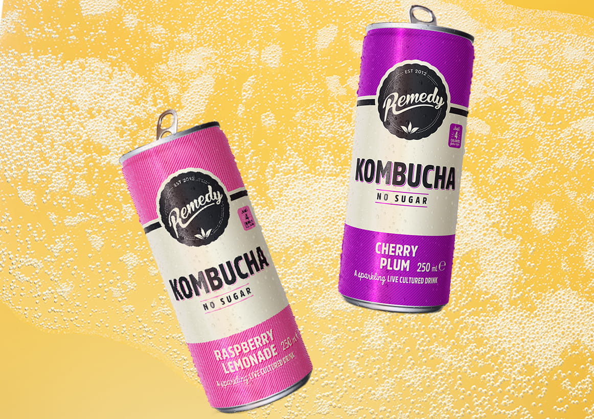 Remedy Kombucha Cans with Fizzy Kombucha Background