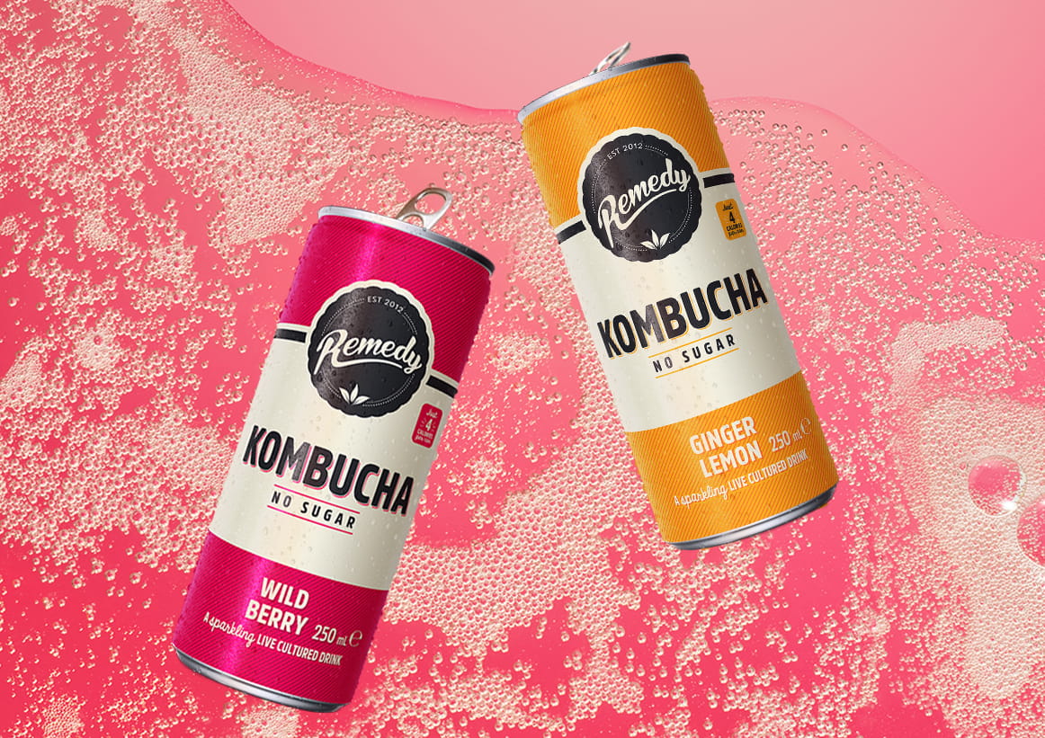 Remedy Kombucha Cans with Fizzy Kombucha Background